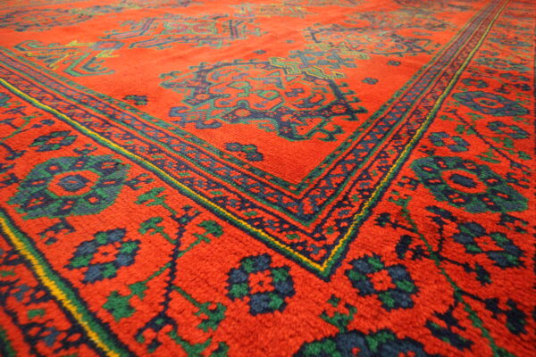 Antique Turkish Ushaq carpet red green blue corner close up