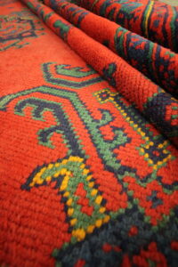 Antique rugs turkish ushak carpet red green blue yellow close up