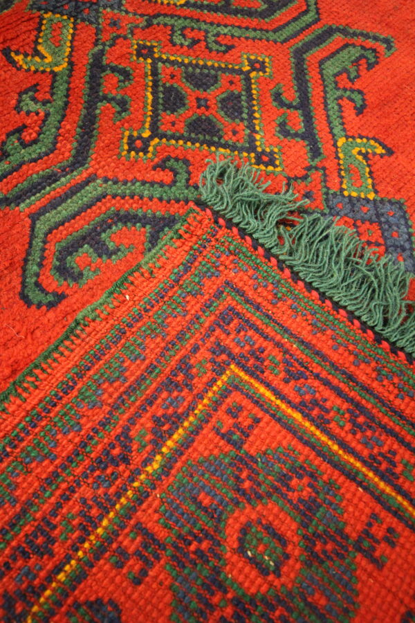 Antique Turkish Ushaq carpet red green tassle close up